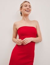 red strapless midi length dress.